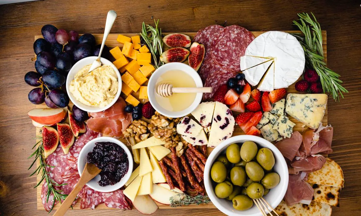 Selection of meats, cheese and fruit on a platter